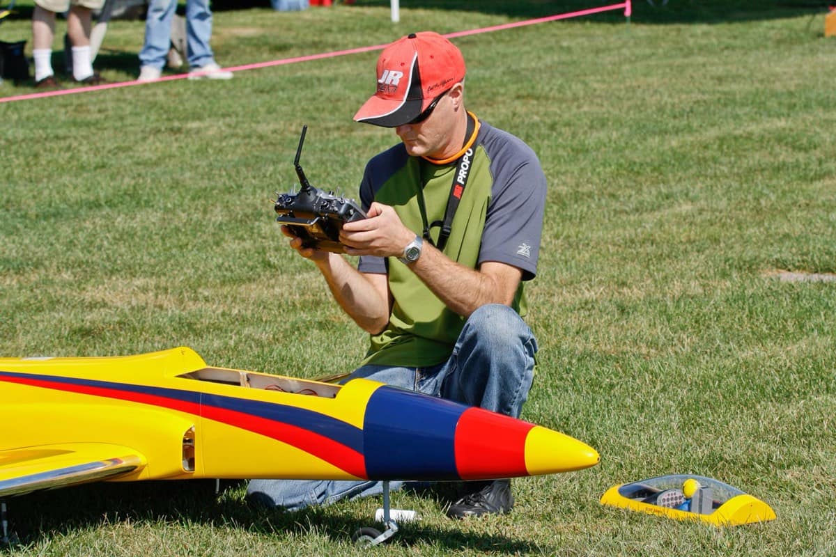 Member preparing a giant-scale RC jet for flight