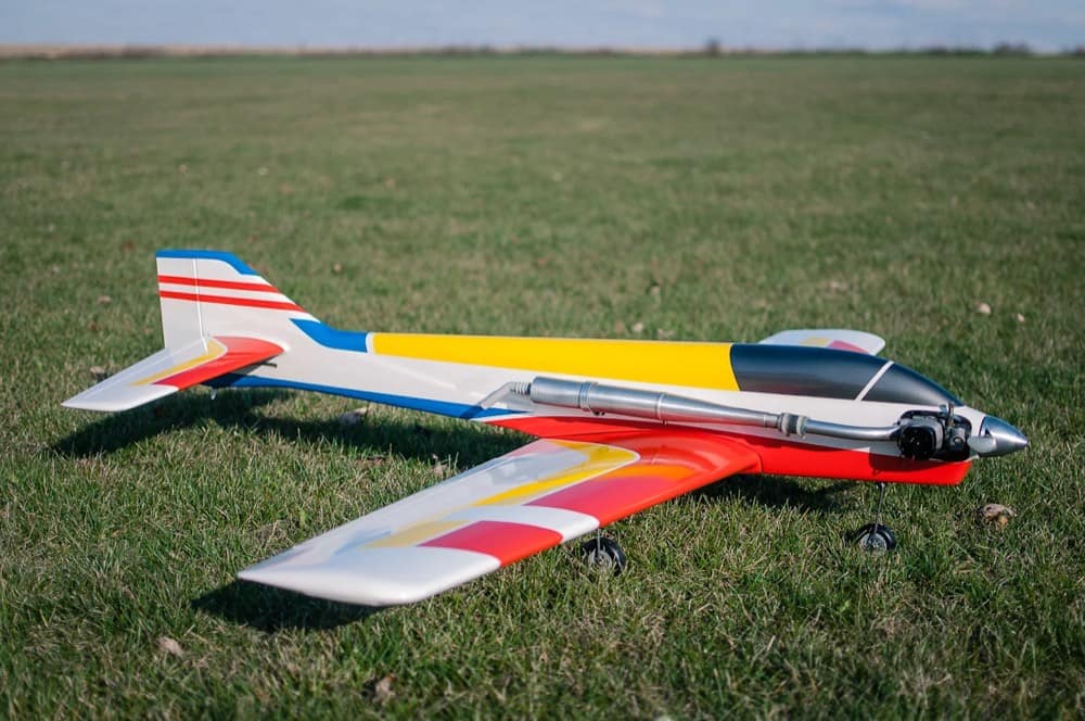 Close-up of a detailed RC plane on the field